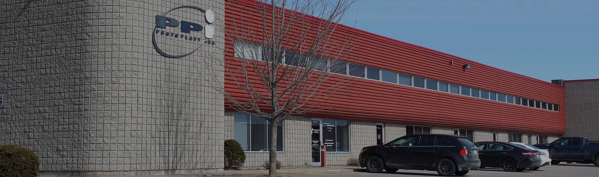 The Protoplast building in Cobourg, Ontario, with the company sign above the entrance