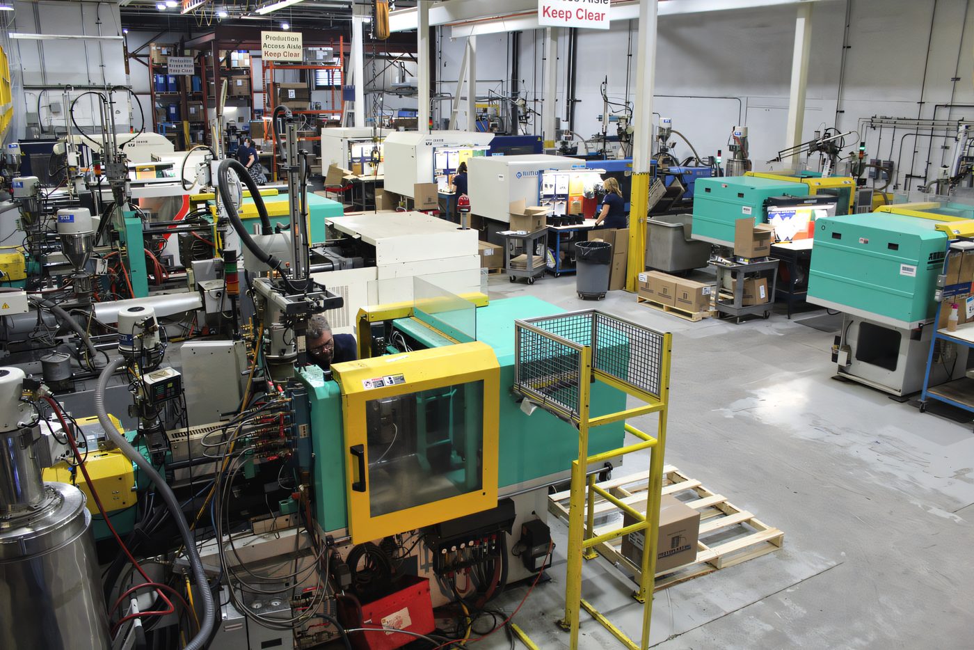 Arburg injection molding presses lined up on the Protoplast production floor